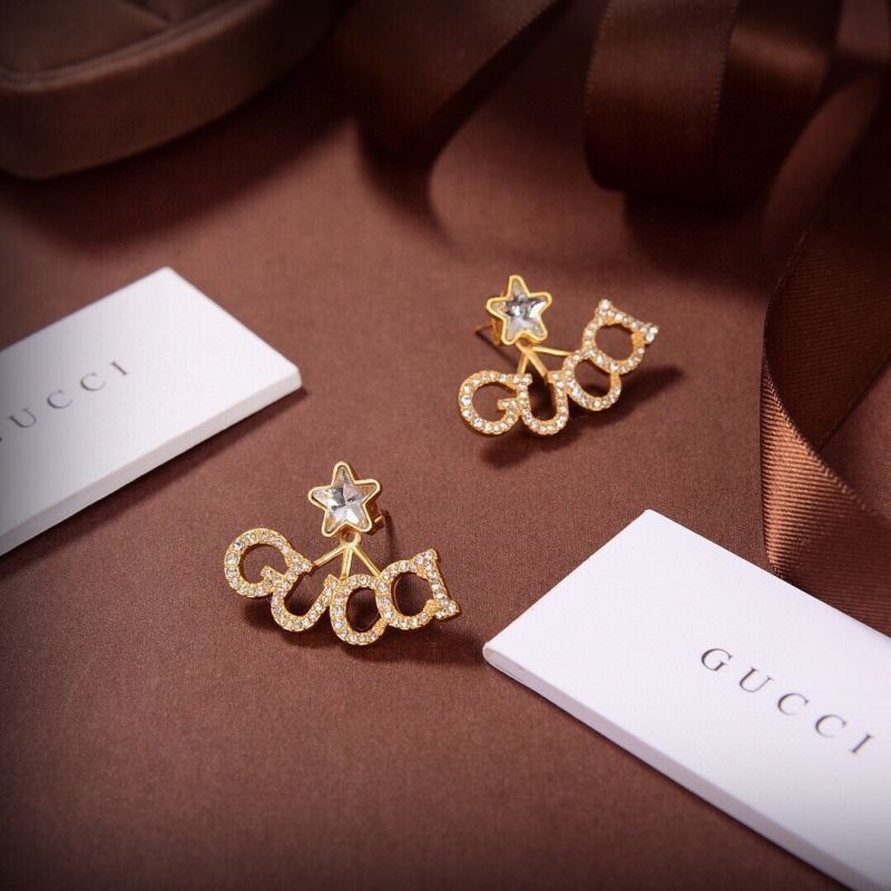 G*u*i earrings